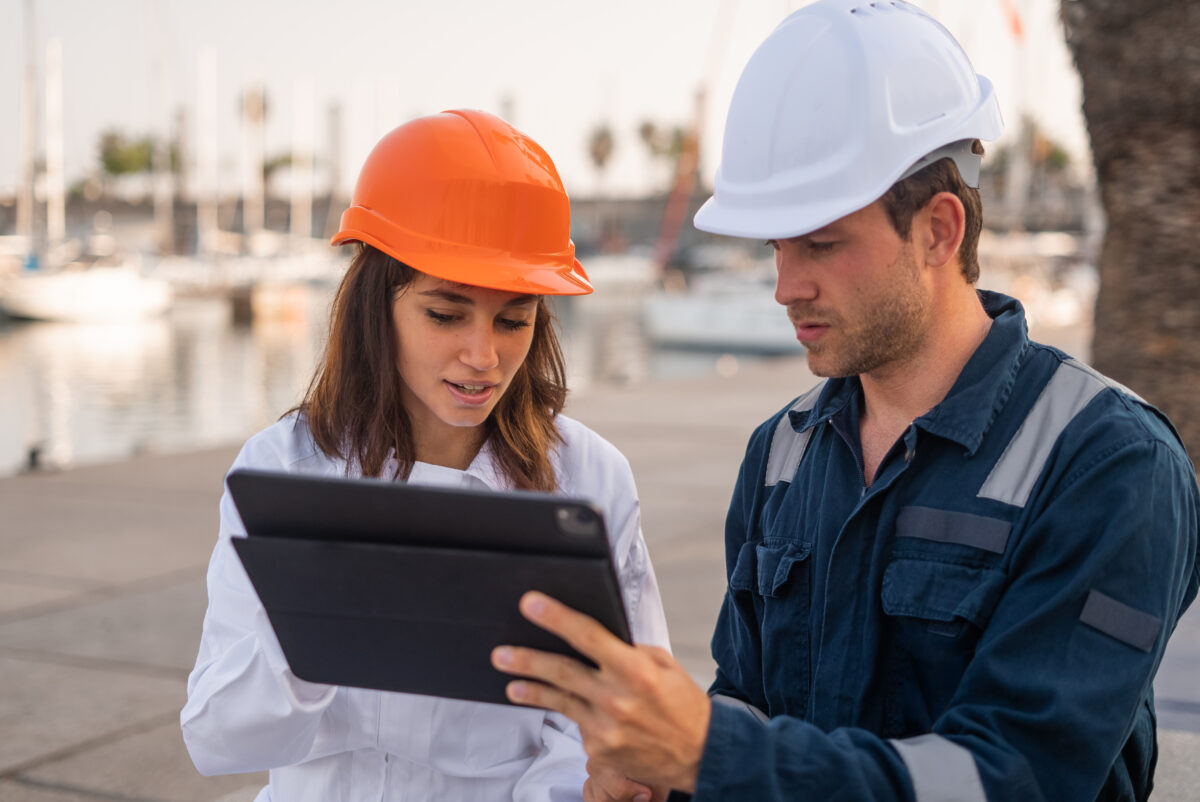 Port engineer and inspector with tablet